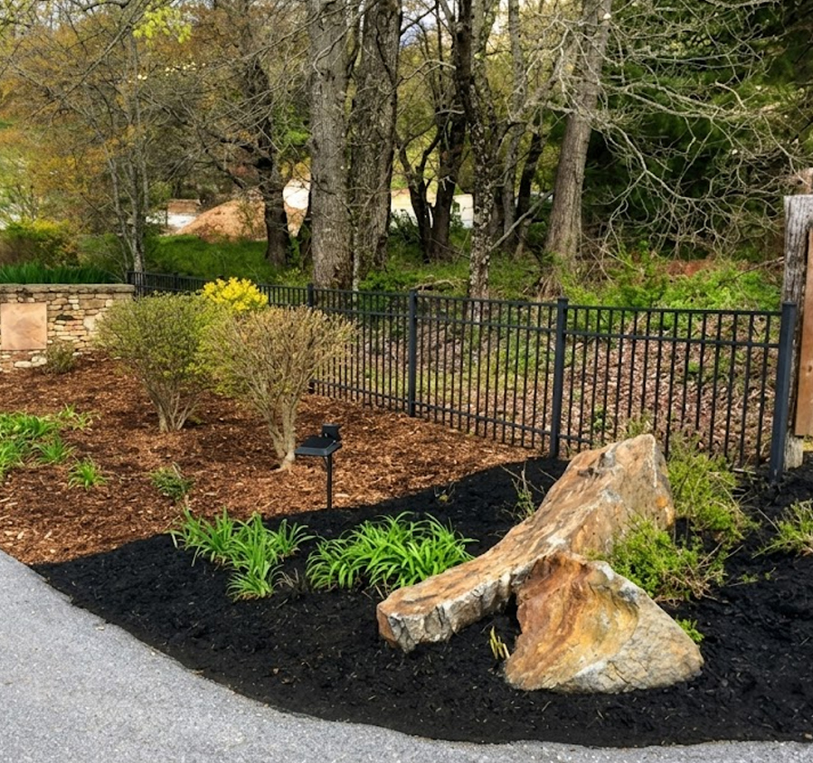 Mulch colorant applied to a landscaped bed